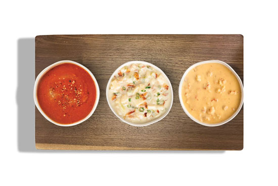 Three cups of soup on a tray